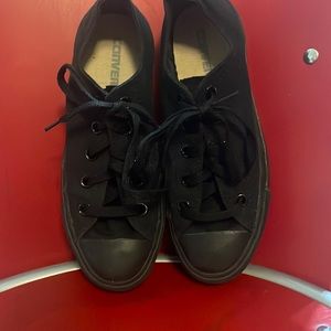 These are all black, low top Converse shoes.
